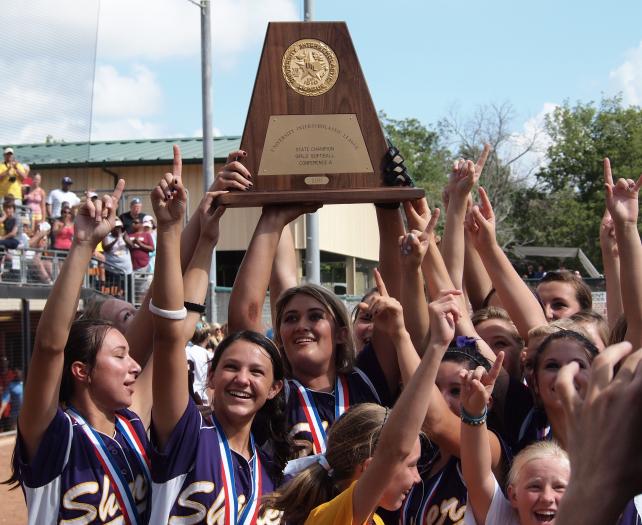 The Shiner Lady Comanches hoist the state championship trophy